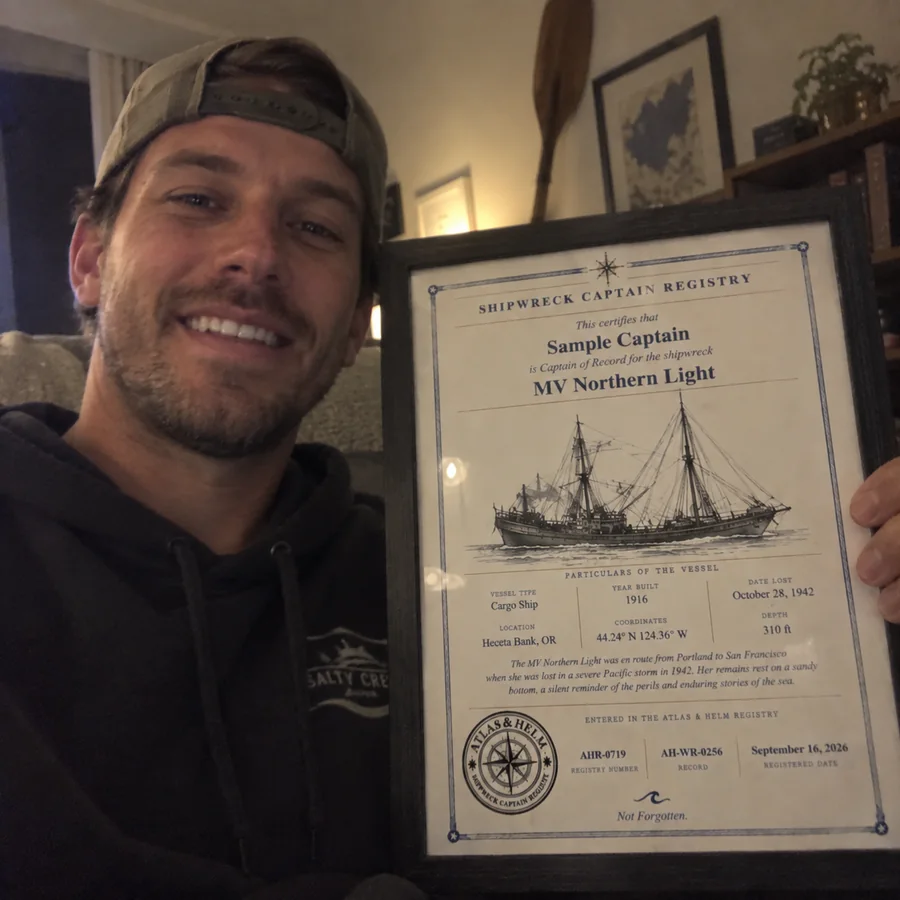 Atlas & Helm Captain displaying a framed shipwreck certificate, portrait 15